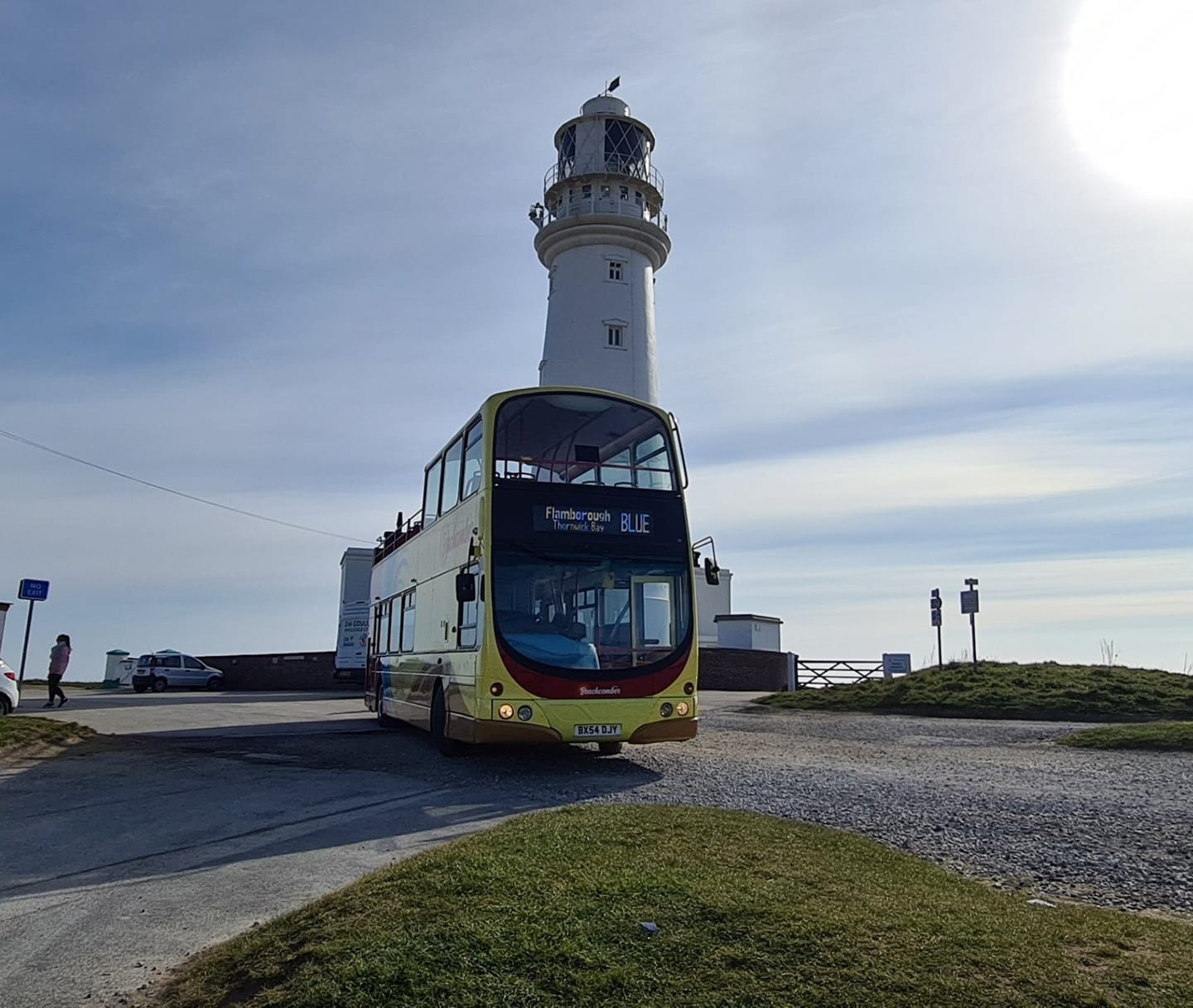 A Beachcomber open top bus in front of Flamborough Lighthouse
