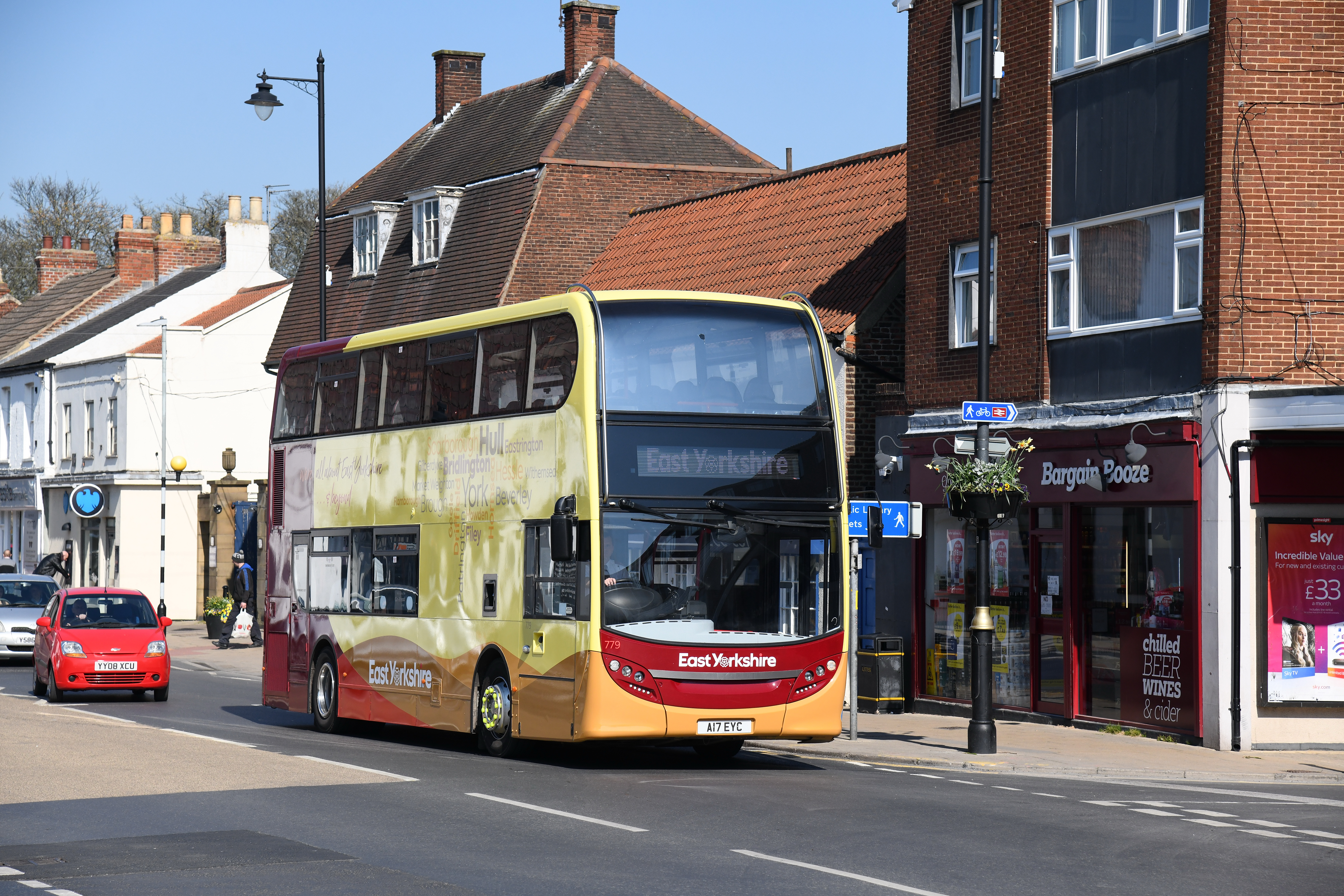 Yellow and red double decker bus