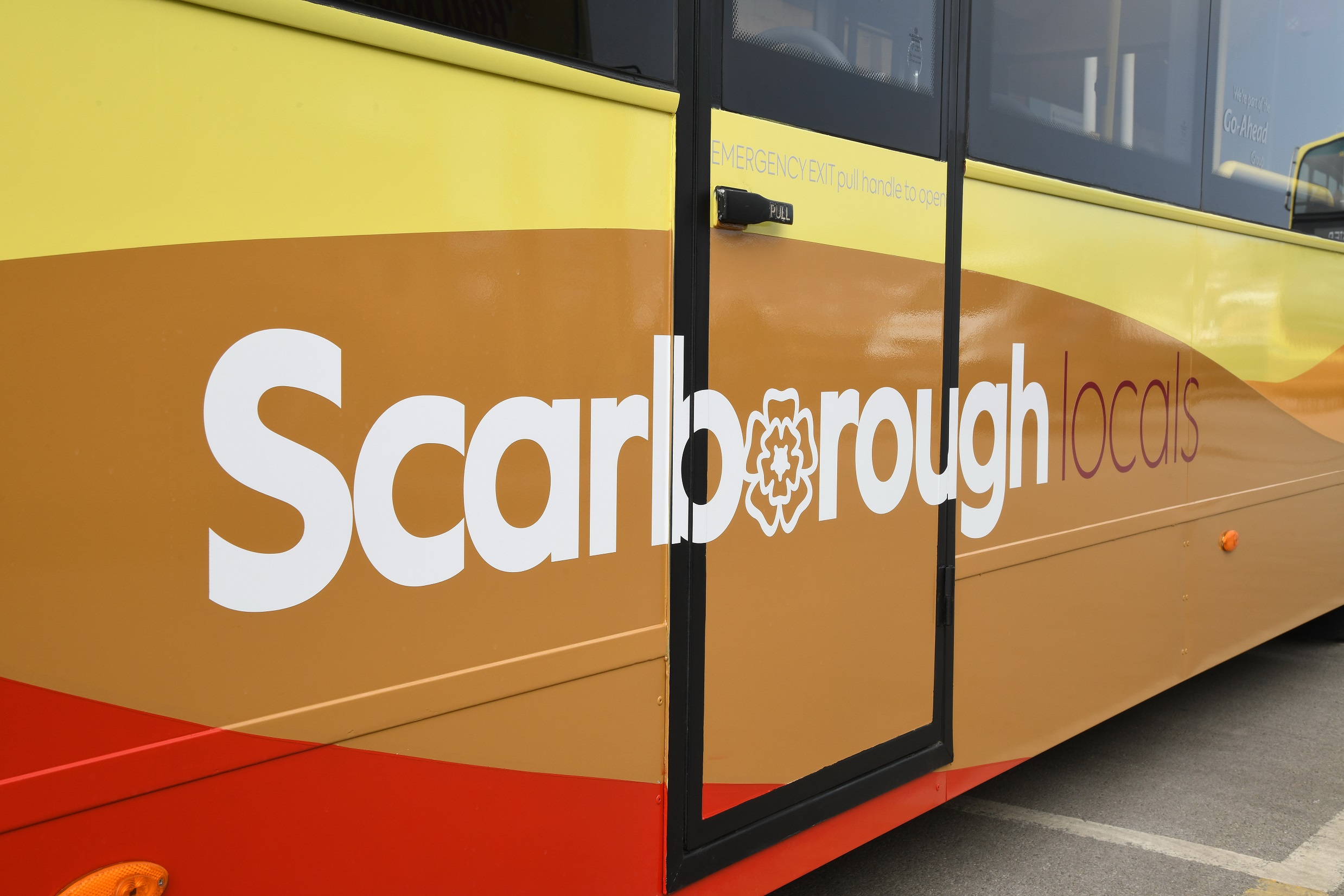 Side of an East Yorkshire bus, text reads: ScarboroughLocals