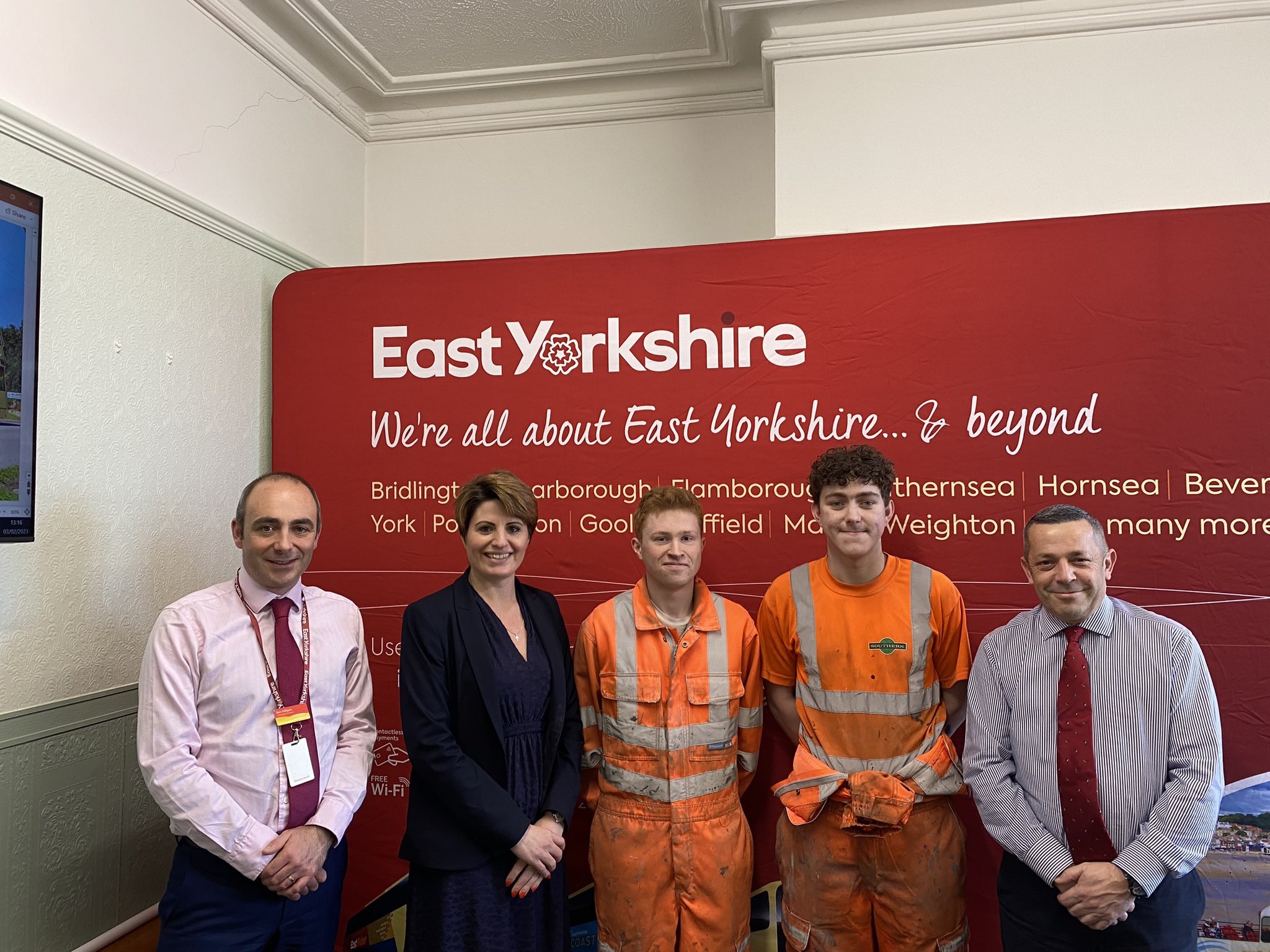 A group of people standing in front of an 'East Yorkshire' sign